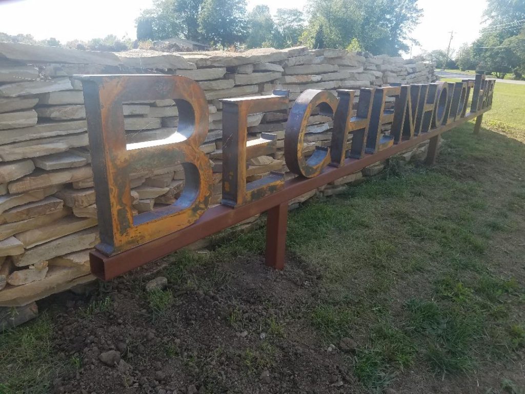 Bechenholdt Park architectural exterior corten sign greenfield