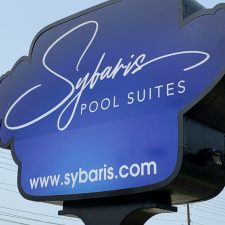 Sybaris Pool Suites sign in blue